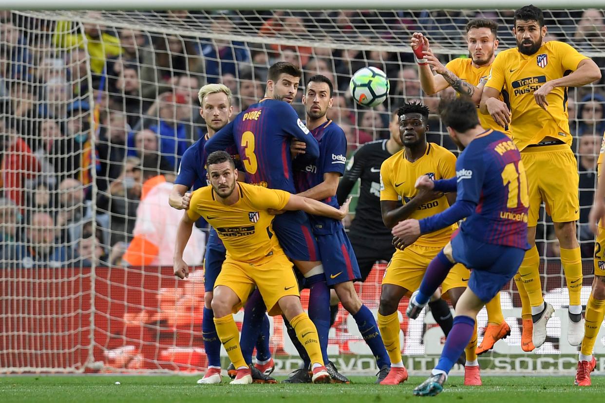 Lionel Messi bent a free kick over the Atletico Madrid wall to send Barcelona eight points clear in La Liga. (Getty)