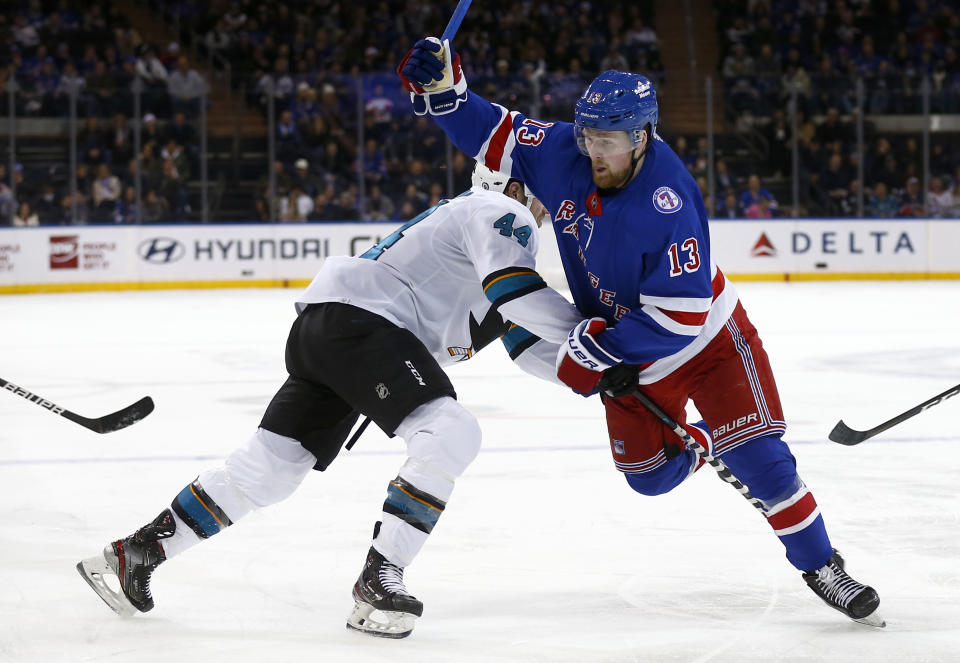 San Jose Sharks' Marc-Edouard Vlasic (44) is called for tripping New York Rangers' Alexis Lafreniere (13) during the second period of an NHL hockey game Friday, Dec. 3, 2021, in New York. (AP Photo/John Munson)