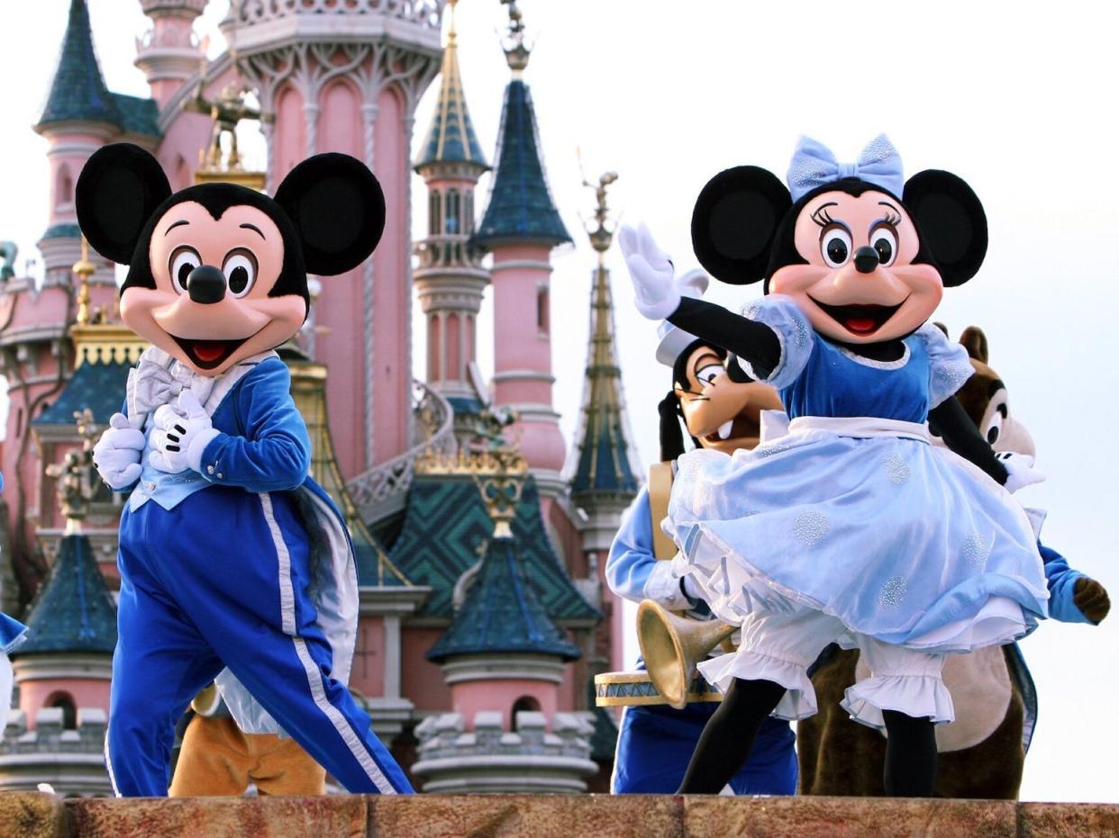 Characters dance at Disneyland Paris on April 4, 2008.