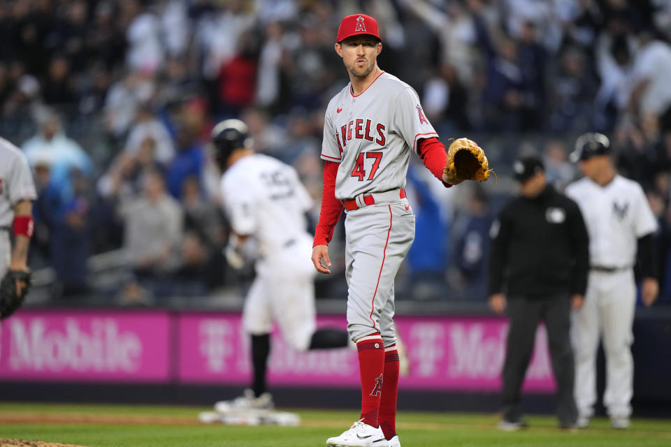 Los Angeles Angels starting pitcher Griffin Canning waits for a new ball as New York Yankees' Aaron Judge runs the bases on a two-run home run during the first inning of a baseball game Wednesday, April 19, 2023, in New York. (AP Photo/Frank Franklin II)