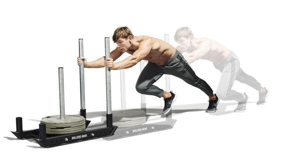 <p>Again, set up in an athletic stance – this time with your torso almost parallel to the ground. Gripping the pipes a third of the way down with your arms locked out, drive <a href="https://www.menshealth.com/uk/building-muscle/a758276/the-best-equipment-youre-not-using-the-prowler/" rel="nofollow noopener" target="_blank" data-ylk="slk:the sled;elm:context_link;itc:0;sec:content-canvas" class="link ">the sled</a> by marching forward as fast as you can, bringing one knee up to your chest as your other leg extends behind you. Work for 60 seconds, then rest for 60 seconds before set two.</p>