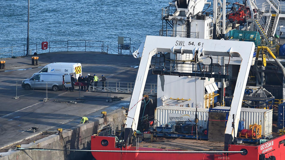 A body is taken off the Geo Ocean III, recovered from the wreckage of a plane carrying Argentine footballer Emiliano Sala at Weymouth harbour. (Photo by Glyn KIRK / AFP) (Photo credit should read GLYN KIRK/AFP/Getty Images)