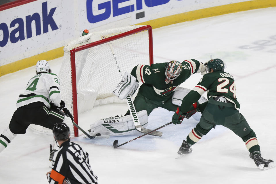 Minnesota Wild's goalie Alex Stalock (32) blocks the shot of Dallas Stars' Denis Gurianov, of Russia, in the first period of an NHL hockey game Saturday, Jan. 18, 2020, in St. Paul, Minn. (AP Photo/Stacy Bengs)