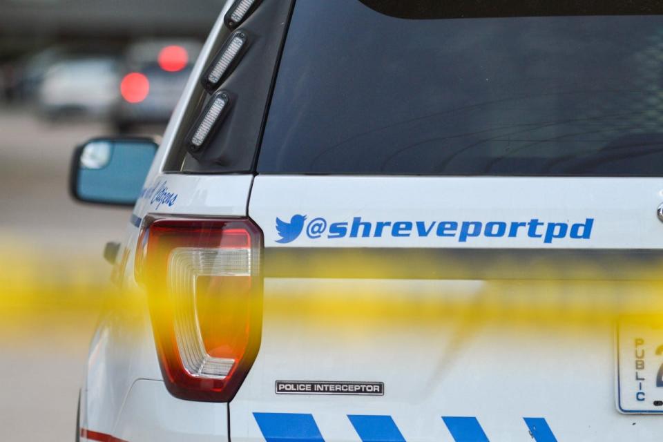 A Shreveport police unit, behind crime scene tape, is blocking the entrance to the parking lot of an apartment complex off East Kings Highway between Carroll Street and Southfield Road in Shreveport on Monday, Aug. 24, 2020. Shreveport police responded to the scene after a report of shots fired.