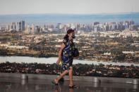 A woman walks as she wears a protective mask during the coronavirus disease (COVID-19) outbreak in Brasilia