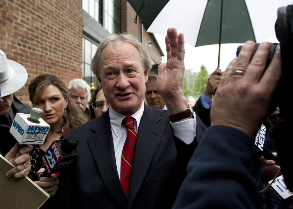 Rhode Island Gov. Lincoln Chafee, center, arrives at the state's Economic Development Corp. headquarters, Monday, May 21, 2012, in Providence, R.I. Former Boston Red Sox pitcher Curt Schilling and Rhode Island's economic development agency met Monday to discuss the finances of his troubled video game company. (AP Photo/Steven Senne)