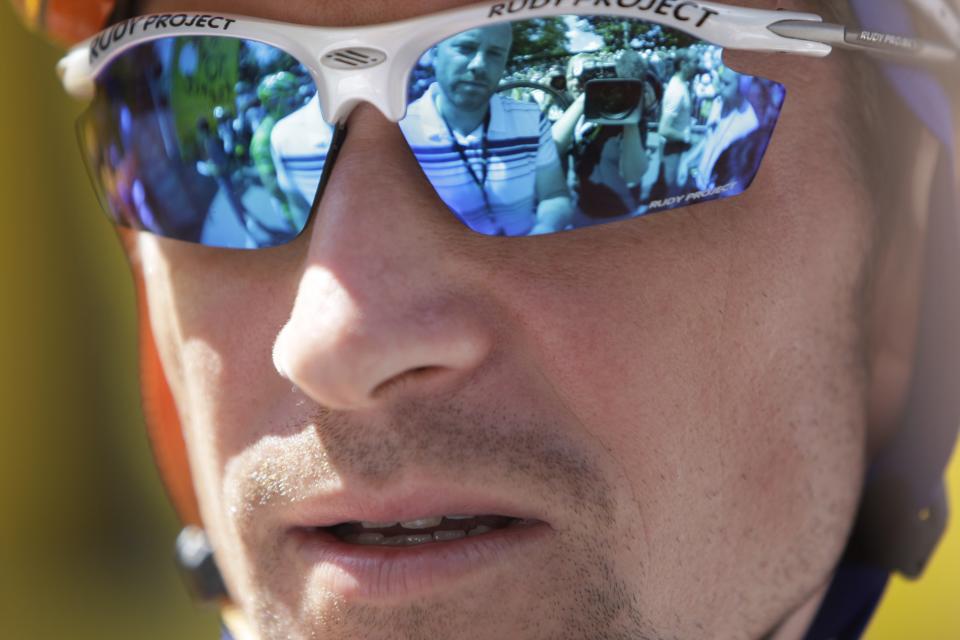 FILE - In this July 14, 2008 filer Denis Menchov of Russia is interviewed ahead of the 10th stage of the Tour de France cycling race between Pau and Hautacam, southern France. Extending the fallout from the Lance Armstrong doping report, at least 15 more cyclists are being linked to the American's banned physician in what is unfolding as an intricate scheme of money laundering, tax evasion and widespread doping. The Gazzetta dello Sport reports that former Giro d'Italia winners Michele Scarponi and Denis Menchov, plus this year's Olympic champion Alexandre Vinokourov, are under investigation for doping under the supervision of Dr. Michele Ferrari. (AP Photo/Bas Czerwinski, fILE)