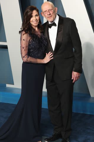 <p>Arturo Holmes/FilmMagic</p> Lisa Loiacono and Christopher Lloyd attend the 2022 Vanity Fair Oscar Party on March 27, 2022 in Beverly Hills, California.