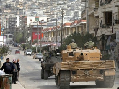 Turkish forces patrol an area in Afrin, Syria March 22, 2018. REUTERS/ Khalil Ashawi