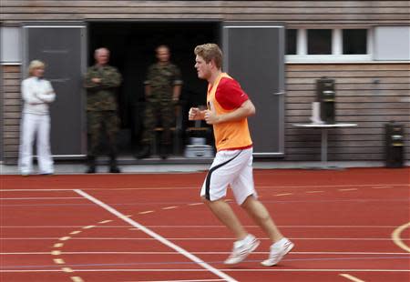 A Swiss man undergoes physical tests for military conscription at a recruiting centre in Sumiswald, outside Bern August 27, 2013. REUTERS/Ruben Sprich