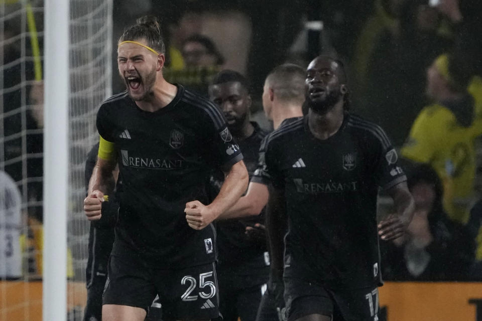 Nashville SC defender Walker Zimmerman (25) celebrates after teammate Taylor Washington scored against CF Montreal in the second half of an MLS soccer game, Saturday, March 11, 2023, in Nashville, Tenn. (AP Photo/Mark Humphrey)