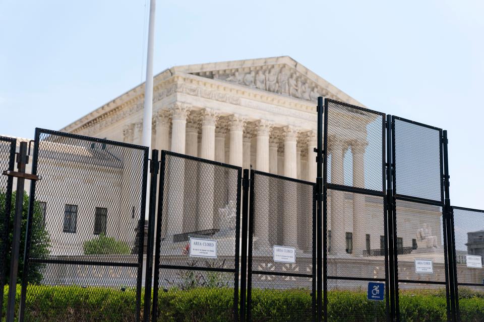 Police barriers protect the Supreme Court in the wake of controversial decisions in the 2022 term.