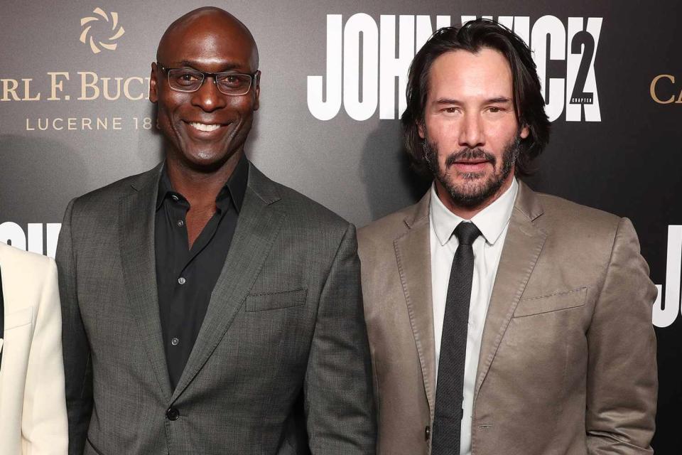 Todd Williamson/Getty Lance Reddick and Keanu Reeves