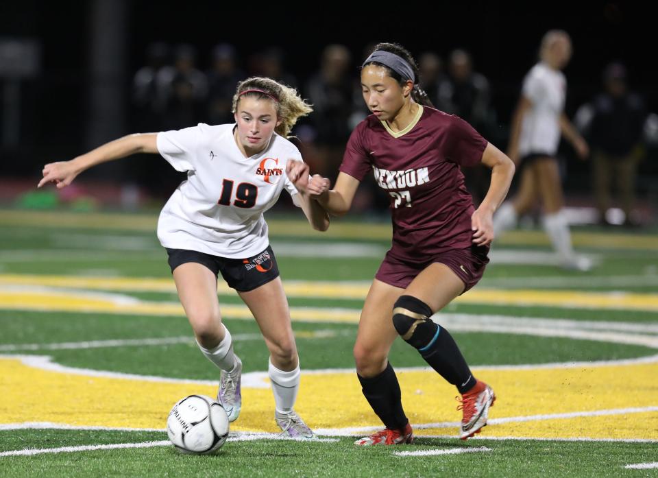 Churchville-Chili's Madison Mastrodonato and Pittsford Mendon's Claire Baek race to the ball during the Section V girls soccer sectionals for Class A on Oct. 26, 2022.  