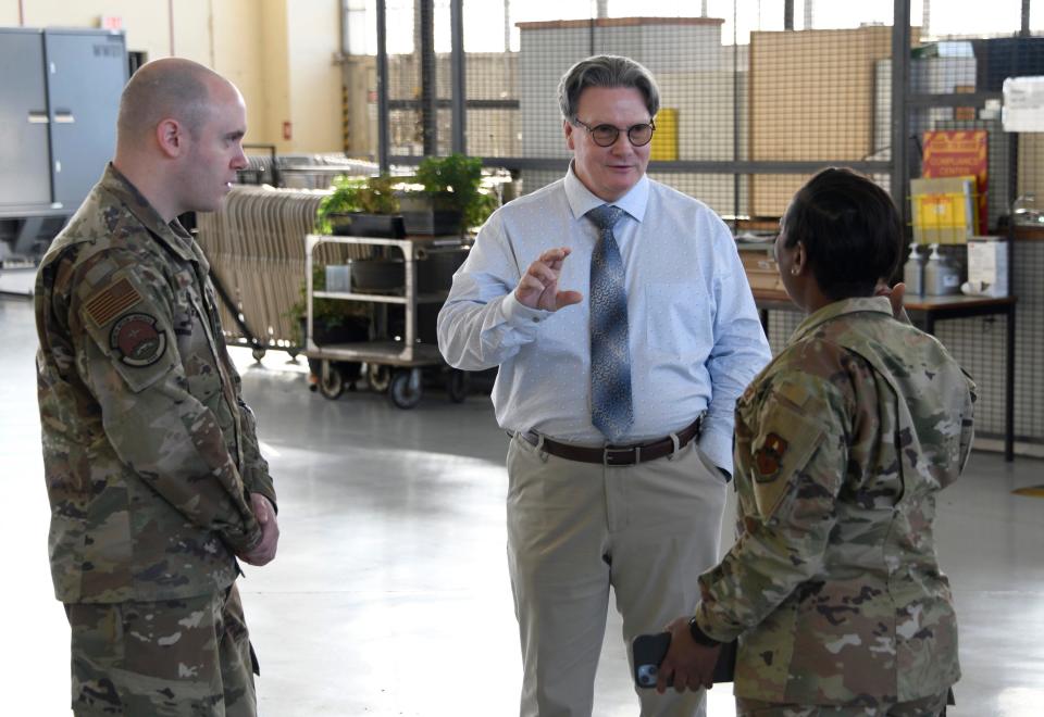 Left, Tech. Sgt. Brian Haga, 908th Maintenance Group, Chief Master Sgt. Alexius Reid, Community College of the Air Force, and Bryan Davis, Federal Aviation Administration, discuss the new FAA Airframe and Powerplant certification program developed at Maxwell Air Force Base, Ala., Jan 20, 2023.