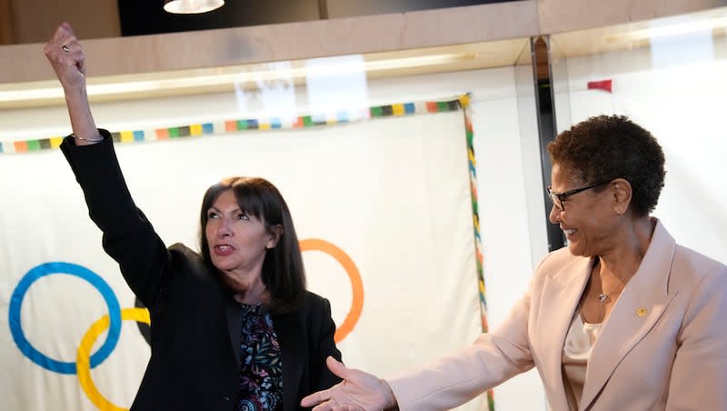 Paris Mayor Anne Hidalgo, left, shares a joke with Los Angeles Mayor Karen Bass during a meeting at the Paris City Hall on Thursday, March 7, 2024. Bass is leading a trip to Paris to prepare for 2028 Olympic Games in Los Angeles.