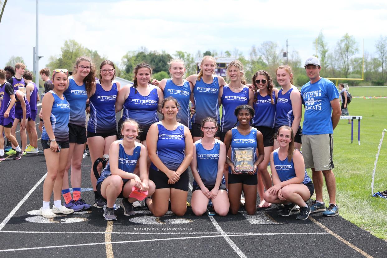 Head coach Brian Smith and the 2021-22 Pittsford varsity girls track and field team.