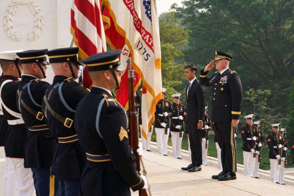 Dozens of personnel from the US army, navy, marines, air force and coastguard, dressed in ceremonial uniforms, formed a guard of honour (PA)
