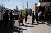 Members of Guatemalan Maya families, who feared their relatives were among 19 bodies found shot and burnt at the weekend in a remote part of northern Mexico, arrive at the Faculty of Medicine for DNA samples to help in the identification, in Guatemala City