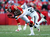 Terrance Copper #15 of Kansas City Chiefs makes a catch as Lito Sheppard #21 of the Oakland Raiders defends during the game on December 24, 2011 at Arrowhead Stadium in Kansas City, Missouri. (Photo by Jamie Squire/Getty Images)