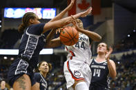 Georgetown's Brianna Scott, left, stops UConn's Aubrey Griffin (44) in the first half of an NCAA college basketball game, Sunday, Jan. 15, 2023, in Hartford, Conn. (AP Photo/Jessica Hill)