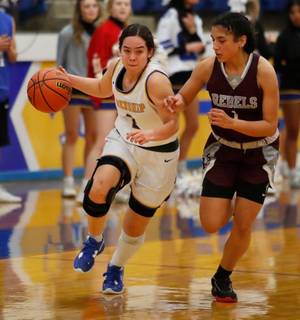 Frenship's Elena Noyola (2) dribbles against Midland Legacy's Natalie Magallanes (1), Tuesday, Jan. 17, 2023, at the Tiger Pit in Wolfforth.