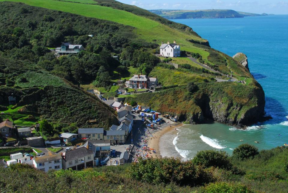 <p>A former a smuggler's haunt, Llangrannog is now a family-friendly sheltered sandy cove at the mouth of a narrow valley. There's another beach that you can walk round to at low tide and for walkers, a wonderful circular walk that can be followed around the headland of Ynys Lochtyn. You'll find traditional pub food overlooking the sea and home-made ice cream at the beach cafe, too.</p><p><strong>Where to stay: </strong>Airbnb has a six-bedroom cottage just 100 yards from Llangrannog Beach. It has a cosy living and dining space, bunk beds for younger guests and a terraced garden area with amazing views at the back of the rental.<br></p><p><a class="link " href="https://airbnb.pvxt.net/GjJDBB" rel="nofollow noopener" target="_blank" data-ylk="slk:SEE INSIDE;elm:context_link;itc:0;sec:content-canvas">SEE INSIDE</a><br></p>