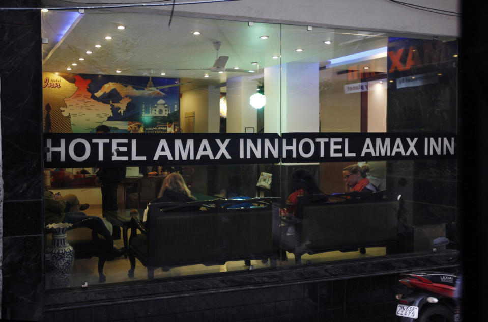 Foreign tourists sit in the lobby of Hotel Amax Inn in New Delhi, India, Wednesday, Jan. 15, 2014. A 51-year-old Danish tourist lost her way and asked for directions back to this hotel was gang-raped Tuesday near a popular central shopping area in the Indian capital, police said Wednesday. The woman managed to reach her hotel Tuesday evening and the owner called police. The attack is the latest case to focus international attention on the scourge of rape and violence against women in India. (AP Photo/Altaf Qadri)