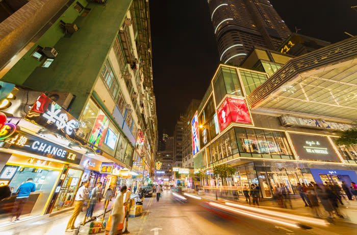 Hong Kong, China - December 14, 2016 : Busy street in Tsim Sha Tsui district. Tsim Sha Tsui is a major tourist hub in metropolitan Hong Kong, with many high-end shops and restaurants that cater to tourist.