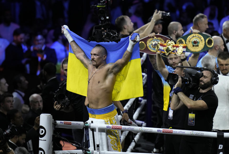 Ukraine's Oleksandr Usyk celebrates after beating Britain's Anthony Joshua to retain his world heavyweight title at King Abdullah Sports City in Jeddah, Saudi Arabia, Sunday, Aug. 21, 2022. (AP Photo/Hassan Ammar)