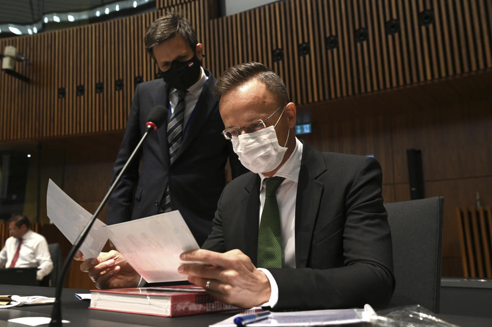 Hungarian Foreign Affairs and Trade Minister Peter Szijjarto looks at paper work, during a European general affairs ministers meeting at the European Council building in Luxembourg, Tuesday, June 22, 2021. (John Thys/Pool Photo via AP)