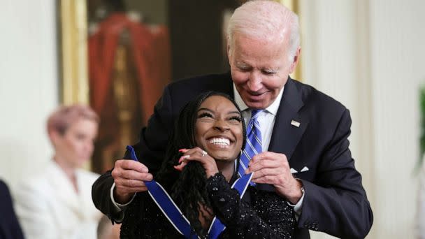 PHOTO: President Joe Biden presents the Presidential Medal of Freedom to Simone Biles, Olympic gold medal gymnast and mental health advocate, during a ceremony in the East Room of the White House, July 7, 2022, in Washington, D.C. (Alex Wong/Getty Images)