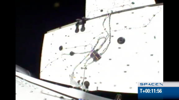 View from SpaceX's Dragon spacecraft looking outward at one of two solar array panels in the process of deploying. Image released May 22, 2012.