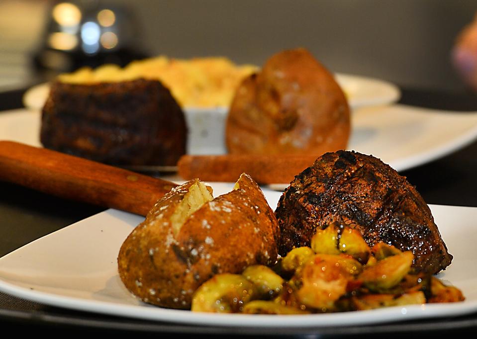 The Prime Restaurant and Whiskey Lounge is now open in Spartanburg. This is a marbled filet grilled with brussels sprouts and a baked potato.