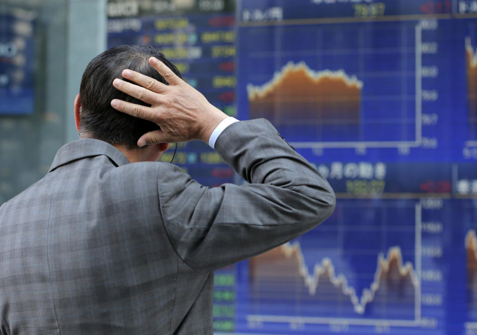  <p> A man watches an electronic stock indicator in Tokyo, Monday, May 14, 2012. Asian stocks also endured losses, although one notable exception was Japan, where the benchmark Nikkei 225 index rose 0.2 percent to close at 8,973.84. (AP Photo/Shizuo Kambayashi) </p>