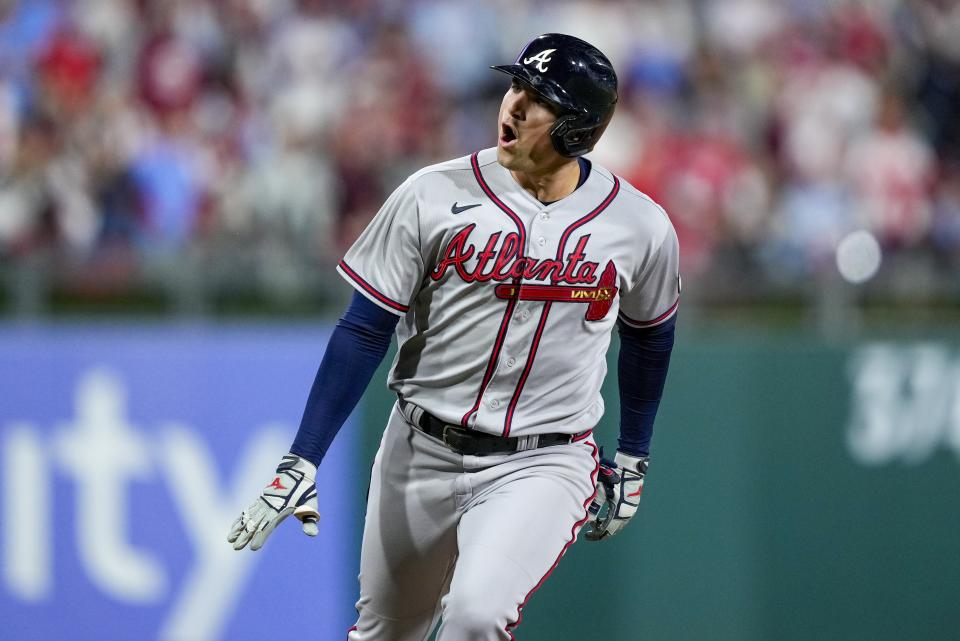 Atlanta Braves' Austin Riley reacts after hitting a home run during the fourth inning of Game 4 of a baseball NL Division Series against the Philadelphia Phillies Thursday, Oct. 12, 2023, in Philadelphia. (AP Photo/Matt Rourke)