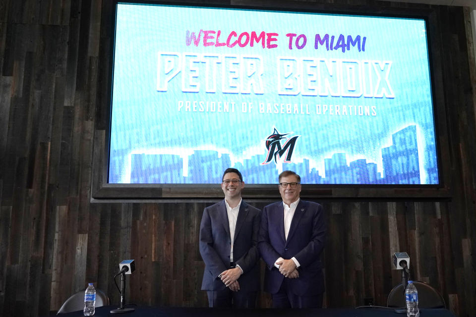 Peter Bendix, Miami Marlins president of baseball operations, left, stands with Miami Marlins owner Bruce Sherman, right, as he is introduced during a news conference, Monday, Nov. 13, 2023, in Miami. (AP Photo/Lynne Sladky)