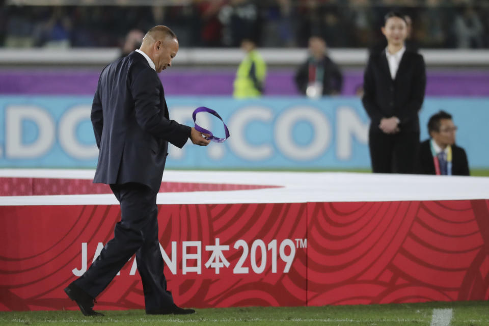 England coach Eddie Jones walks on the field after England was defeated by South Africa in the Rugby World Cup final at International Yokohama Stadium in Yokohama, Japan, Saturday, Nov. 2, 2019. (AP Photo/Eugene Hoshiko)