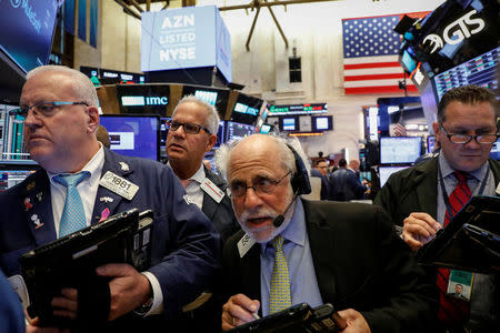 Traders work on the floor of the New York Stock Exchange (NYSE) in New York, U.S., October 4, 2017. REUTERS/Brendan McDermid