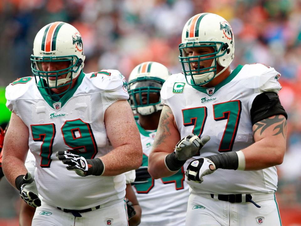 Jake Long walks onto the field for the Miami Dolphins.