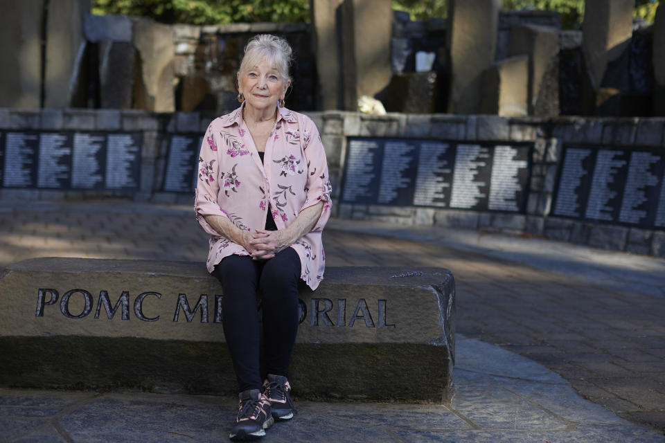 Mary Elledge, whose son was murdered in 1986 and is the head of the greater Portland chapter of Parents of Murdered Children, sits at a memorial in Oregon City, Ore., on July 20, 2022. Elledge is a registered Democrat but this November she will vote for the independent candidate for Oregon governor because she feels Democrats are too progressive on issues like bail and sentencing reform and early release. (AP Photo/Craig Mitchelldyer)