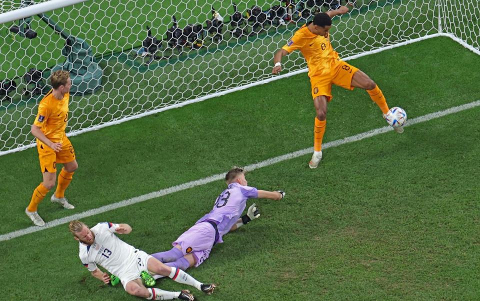 Meet Cody Gakpo: The boy with size 12 feet who became star of the World Cup - Netherlands' forward #08 Cody Gakpo makes a save on the goal line as USA's defender #13 Tim Ream made an attempt to score past Netherlands' goalkeeper #23 Andries Noppert during the Qatar 2022 World Cup round of 16 football match between the Netherlands and USA at Khalifa International Stadium in Doha on December 3 - Giuseppe Cacace/Getty Images