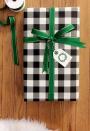 <p>No DIY tricks here! Just classic Christmas green ribbon and buffalo plaid wrapping paper for a holiday color palette everyone will love.<br></p><p><strong>Learn more at <a href="http://www.designandcaroline.com/?p=223" rel="nofollow noopener" target="_blank" data-ylk="slk:Design & Caroline;elm:context_link;itc:0;sec:content-canvas" class="link ">Design & Caroline</a>. </strong> </p>