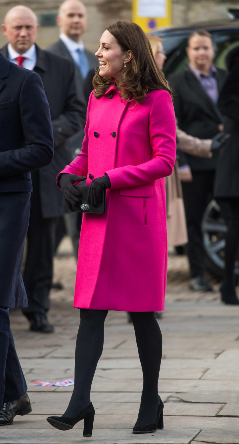 <p><strong>The occassion:</strong> A visit to Coventry Cathedral in Coventry. <br><strong>The look:</strong> A Mulberry double-breasted fucshia coat with the Mulberry Bayswater clutch, Tod’s black suede pumps and Kiki McDonough drop earrings. <br>[Photo: Getty] </p>
