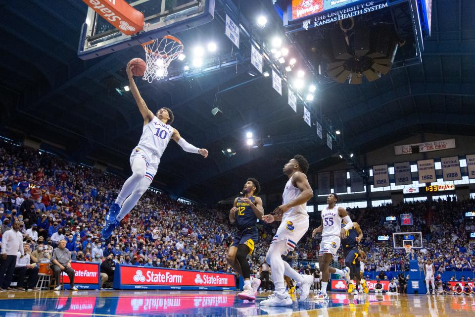 Kansas redshirt sophomore guard Jalen Wilson (10) lays in for two against West Virginia during the first half of Saturday's game inside Allen Fieldhouse.