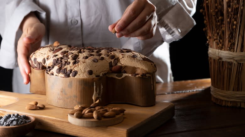 person making chocolate chip colomba