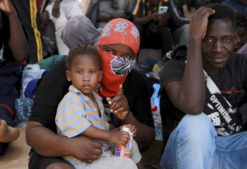 Migrants sit during a gathering in Sfax, Tunisia's eastern coast, Friday, July 7, 2023. Tensions spiked dangerously in a Tunisian port city this week after three migrants were detained in the death of a local man, and there were reports of retaliation against Black foreigners and accounts of mass expulsions and alleged assaults by security forces. (AP Photo)