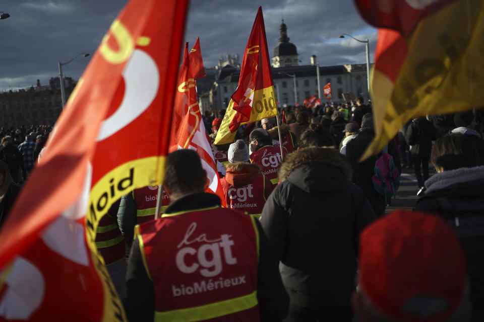 Demonstrators of CGT Merieux bio lab unions take part to a protest march against plans to push back France's retirement age, in Lyon, central France, Tuesday, Jan. 31, 2023. Labor unions aimed to mobilize more than 1 million demonstrators in what one veteran left-wing leader described as a "citizens' insurrection." The nationwide strikes and protests were a crucial test both for President Emmanuel Macron's government and its opponents. (AP Photo/Laurent Cipriani)