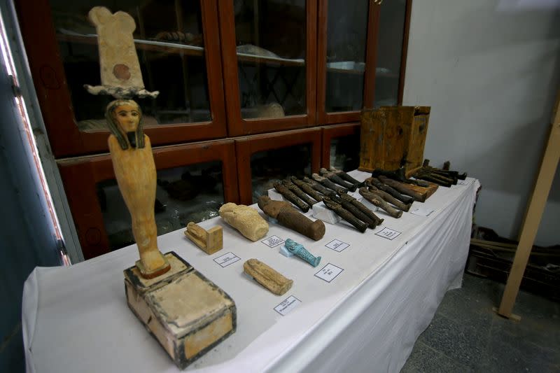 Artifacts, part of a recent discovery from the Saqqara necropolis, are seen south of Cairo