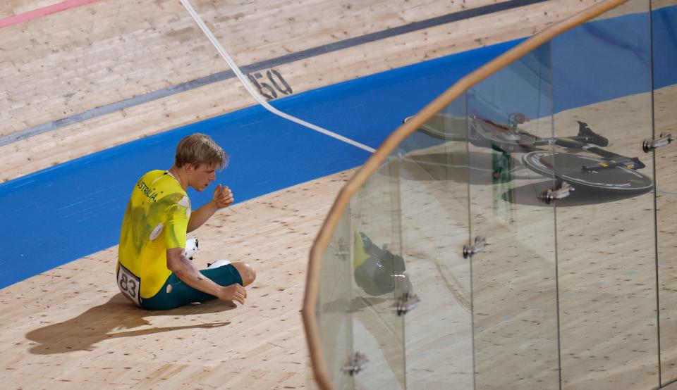 Australia's Alexander Porter reacts after crashing during the men's track cycling team pursuit qualifying event during the Tokyo 2020 Olympic Games at Izu Velodrome in Izu, Japan, on August 2, 2021. (Photo by Odd ANDERSEN / AFP) (Photo by ODD ANDERSEN/AFP via Getty Images)